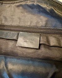 Close-up of the Gucci “made in Italy” leather tag inside the bag.