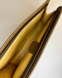 The pouch opens into a spacious interior lined in soft leather. A warm, timeless inside that shows the quality and care of vintage Gucci craftsmanship.