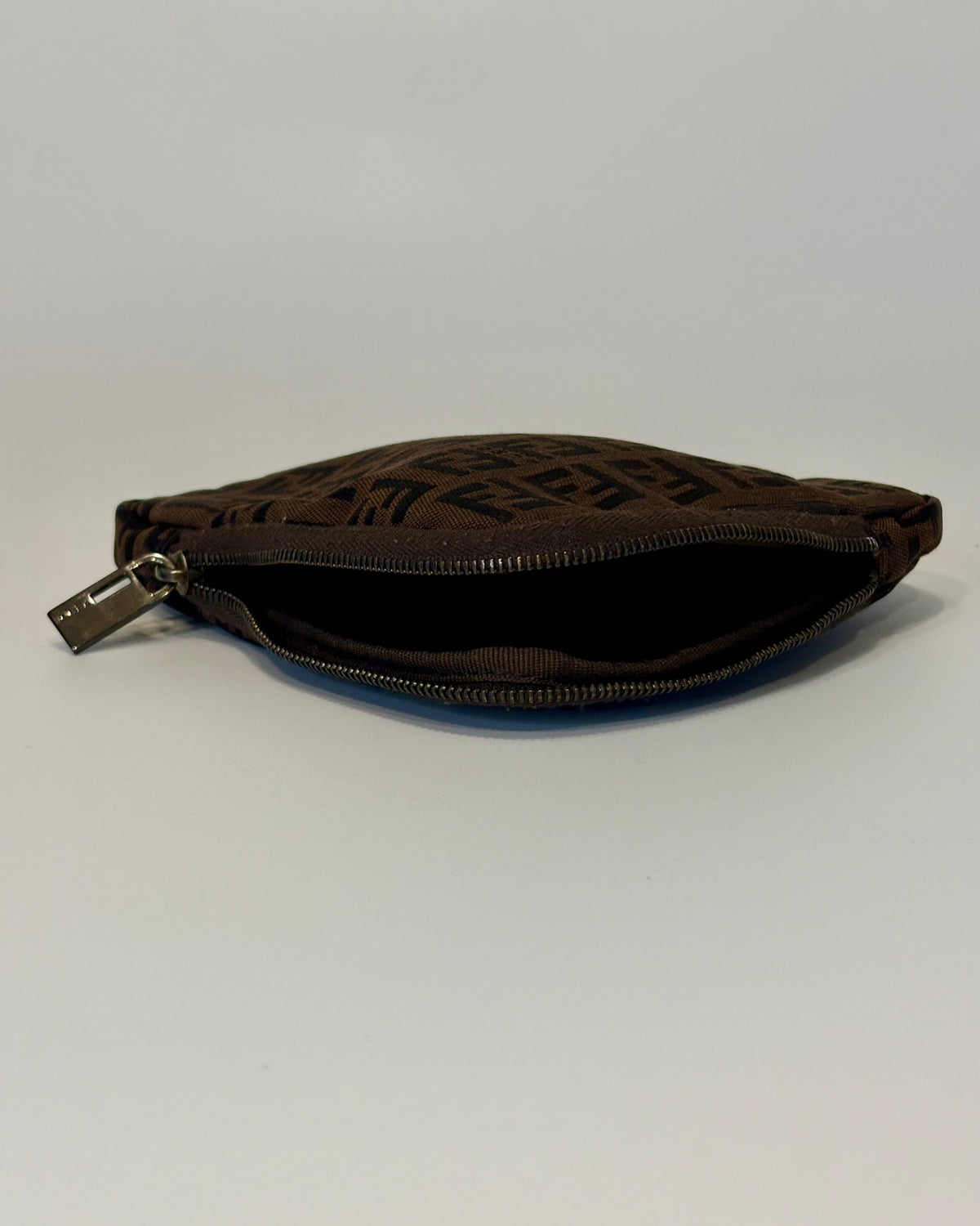Fendi brown zip pouch featuring the iconic FF monogram pattern