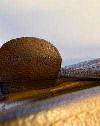 Detail photo of the Gucci serial number 014·123·6063 inside the vintage GG Supreme pouch.